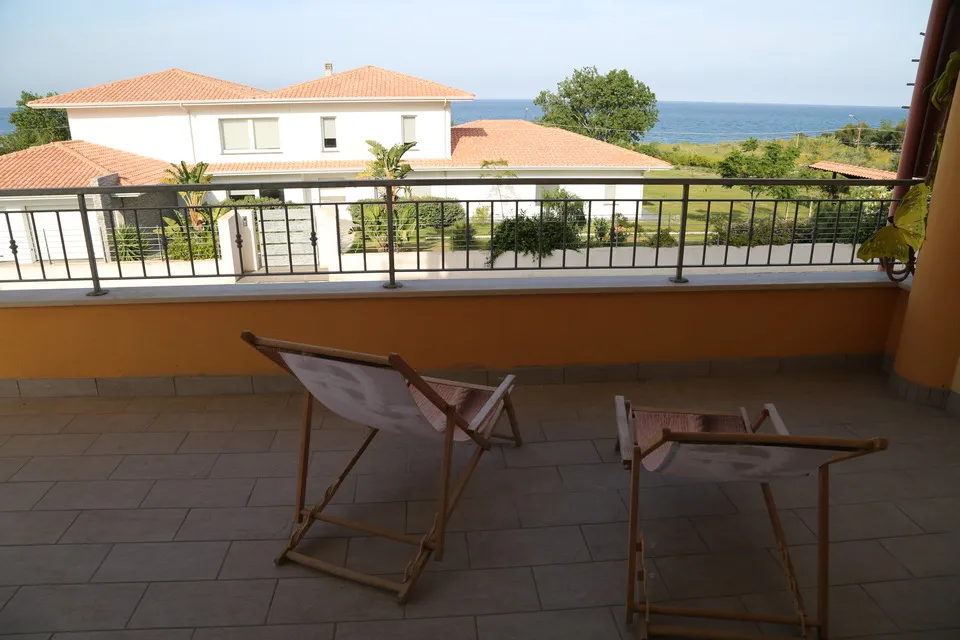 Balcony chairs overlooking the sea at Montagna