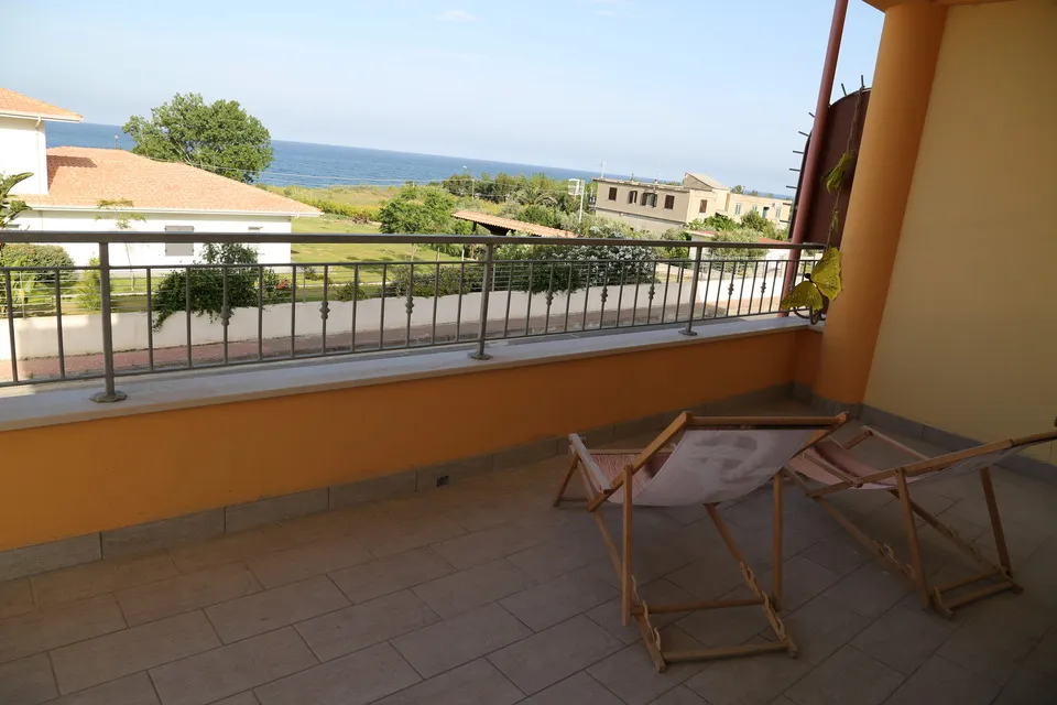 Balcony view overlooking the beach