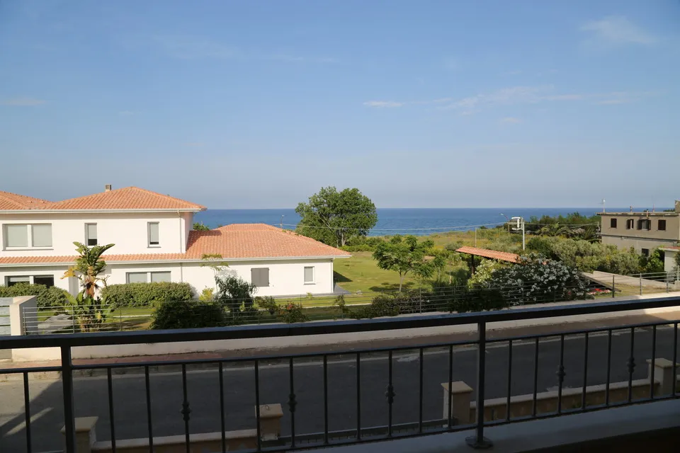 Close-up of the balcony railing overlooking the beach