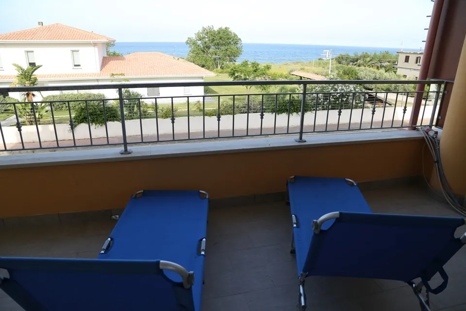 Sole's balcony with lounge chairs overlooking the sea