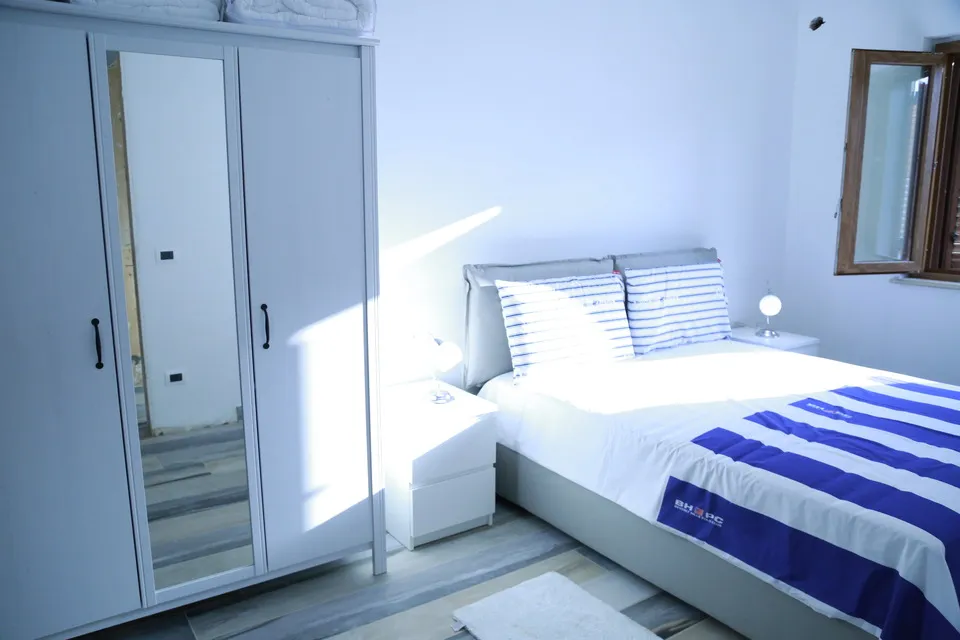 Master bedroom bed and armoire